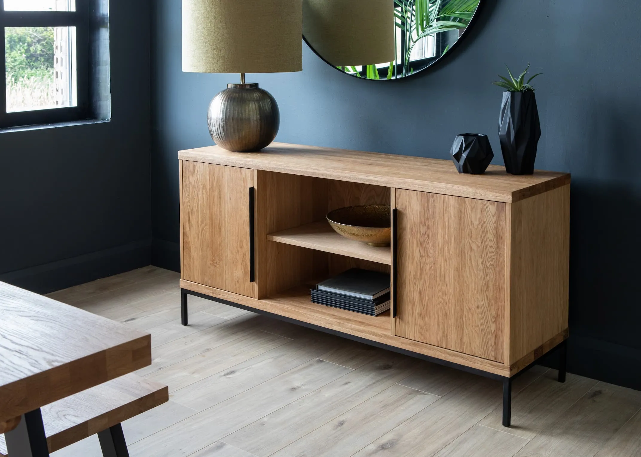 A lifestyle image of the Sideboard with Bolcho lamp with elling mirror