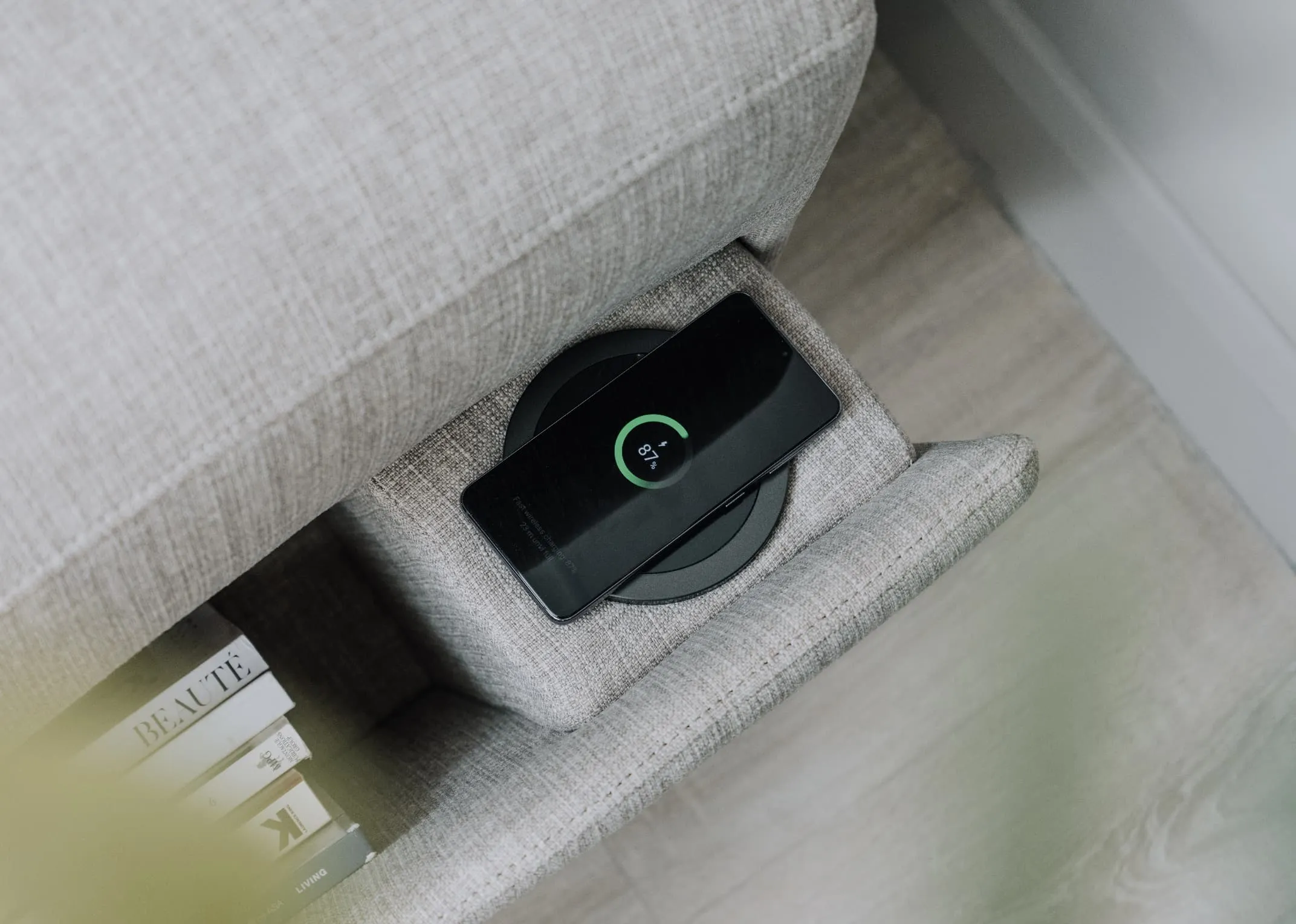 A lifestyle image of the Murano sofabed with side phone charging.