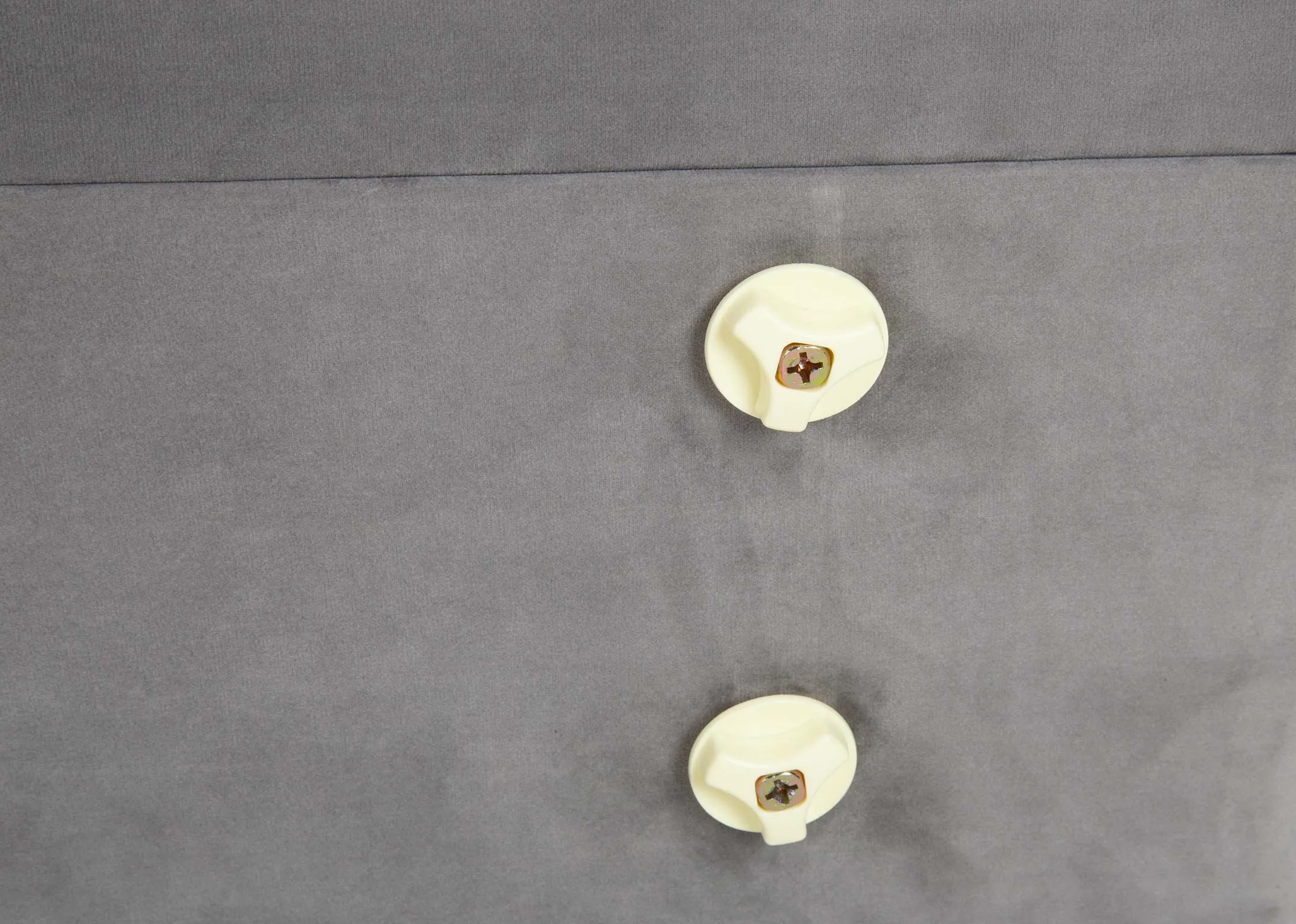 A 4ft grey small double fabric full opening ottoman bed from EZ Livings Parma range. Front view shows silver castors