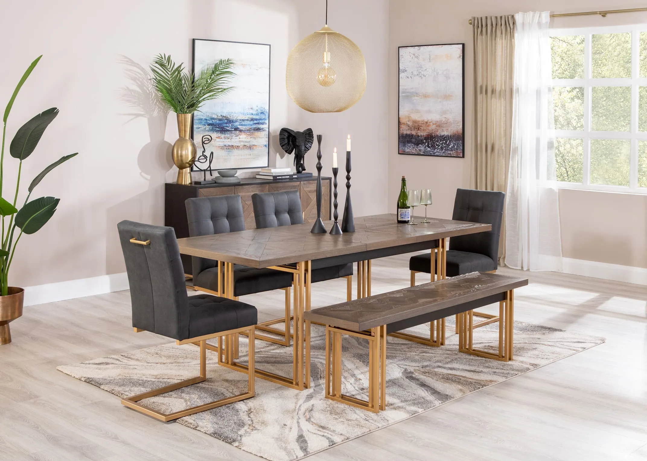 A lifetsyle image of the Greenwich Dining table with the matching chairs and sideboard with pasha rug.