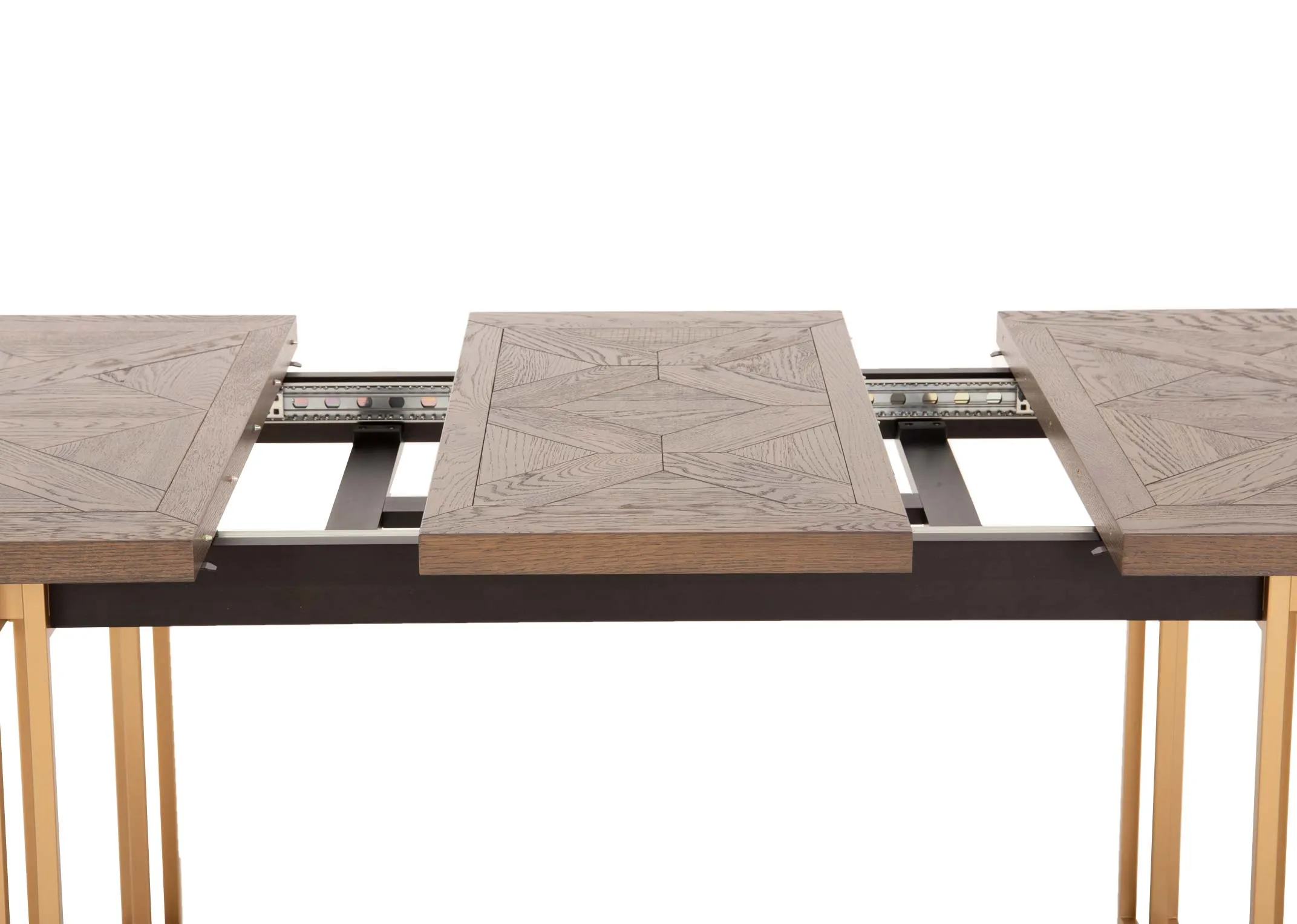 A gold metal framed dining table with dark wood top from EZ Livings Greenwich range. Closeup of extension leaf lifted and inserted to create 2 extra spaces at the table