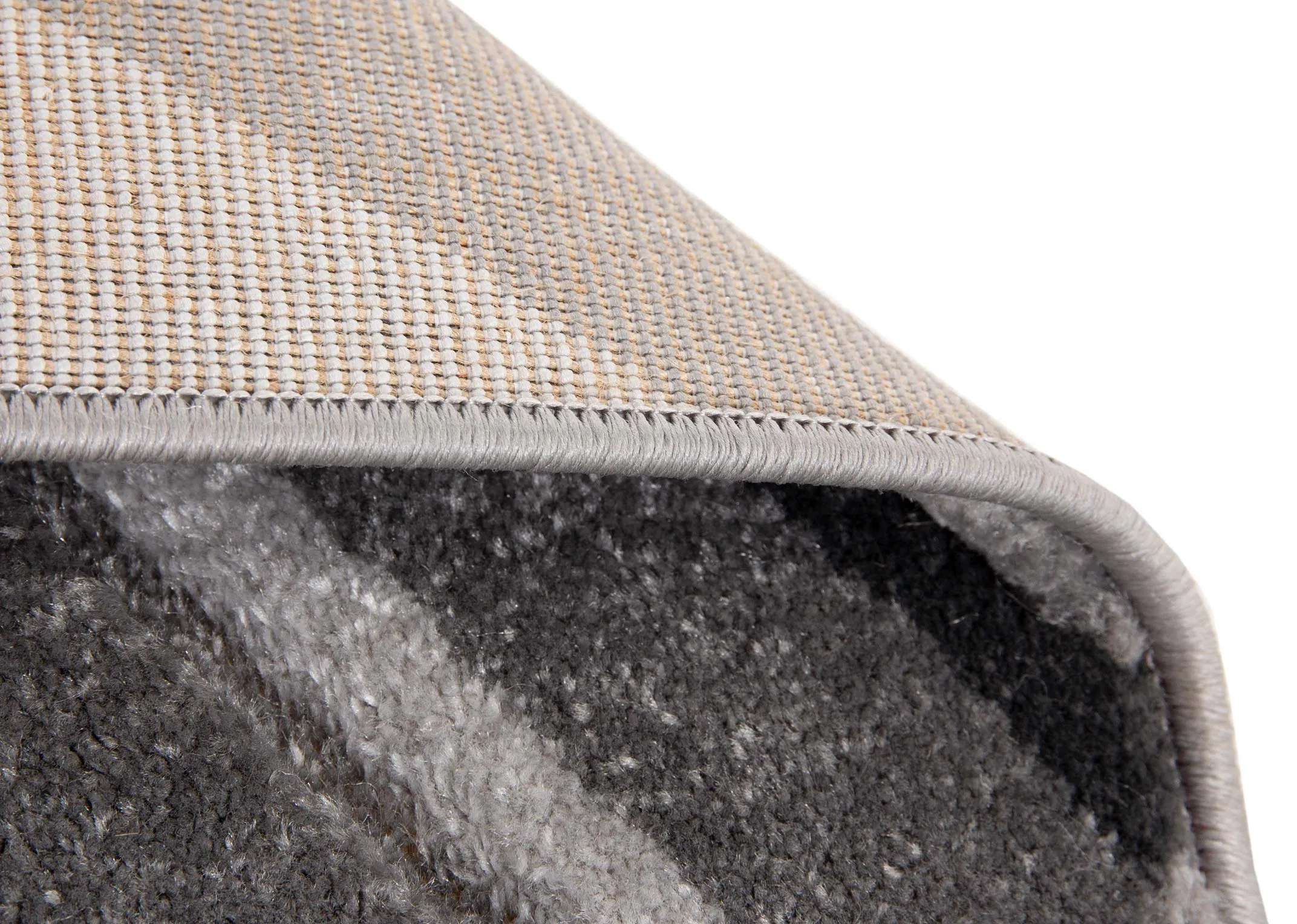 A grey rug with cream and black octagon pattern design from EZ Livings Forma range. Horizontal view