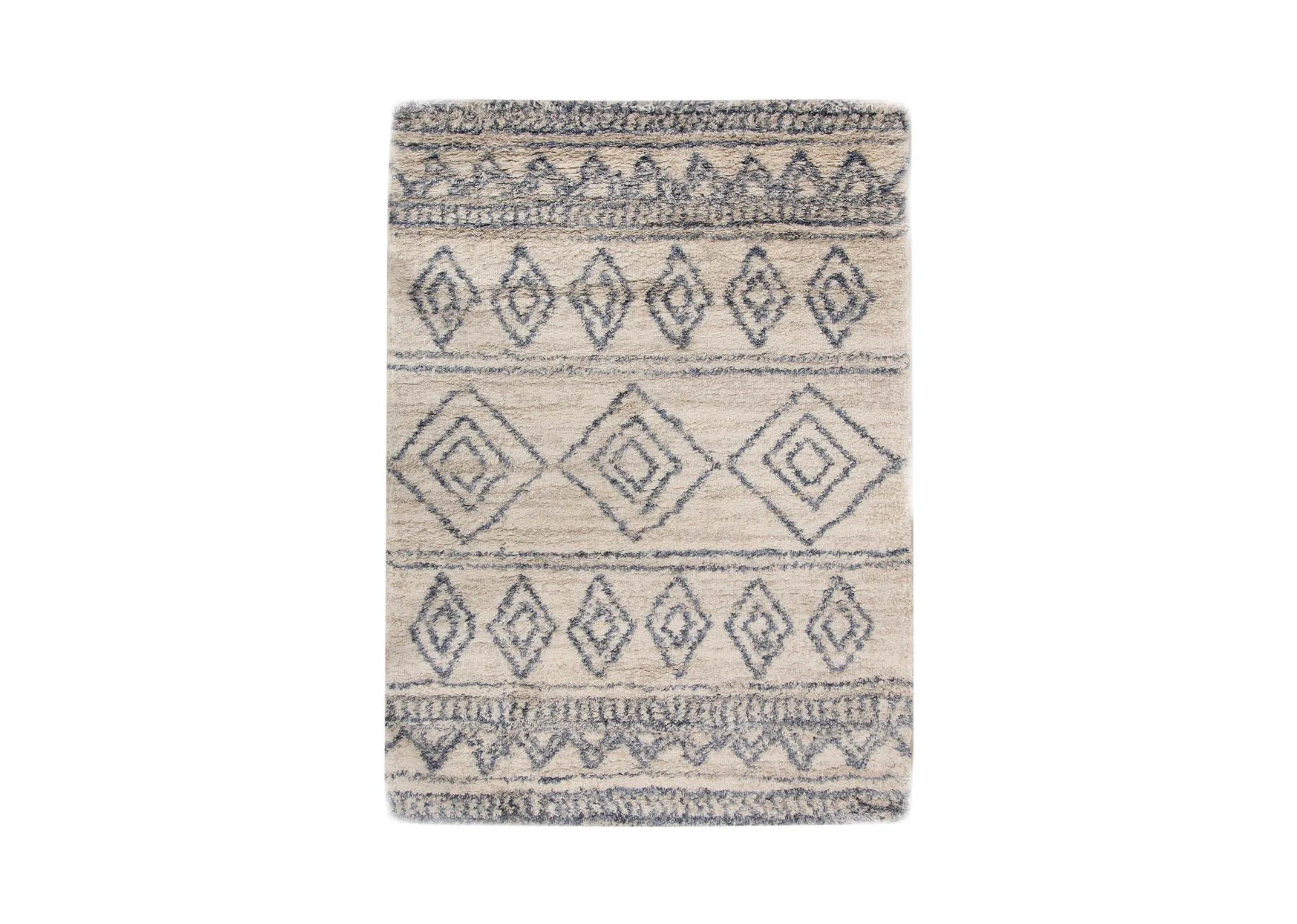 A creamy white deep pile rug with blue Aztec print from EZ Livings Sula range. Front view