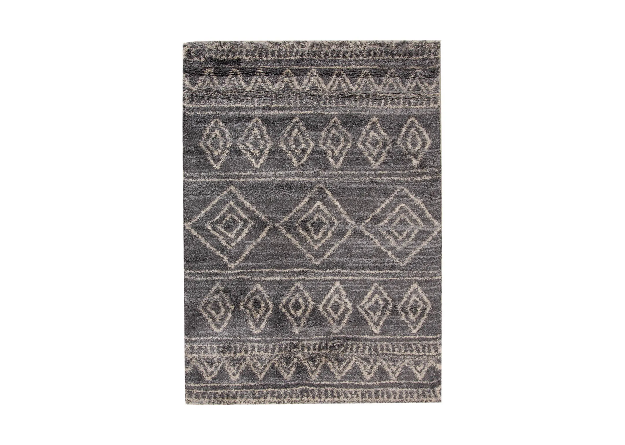 A dark grey deep pile rug with white Aztec print from EZ Livings Sula range.