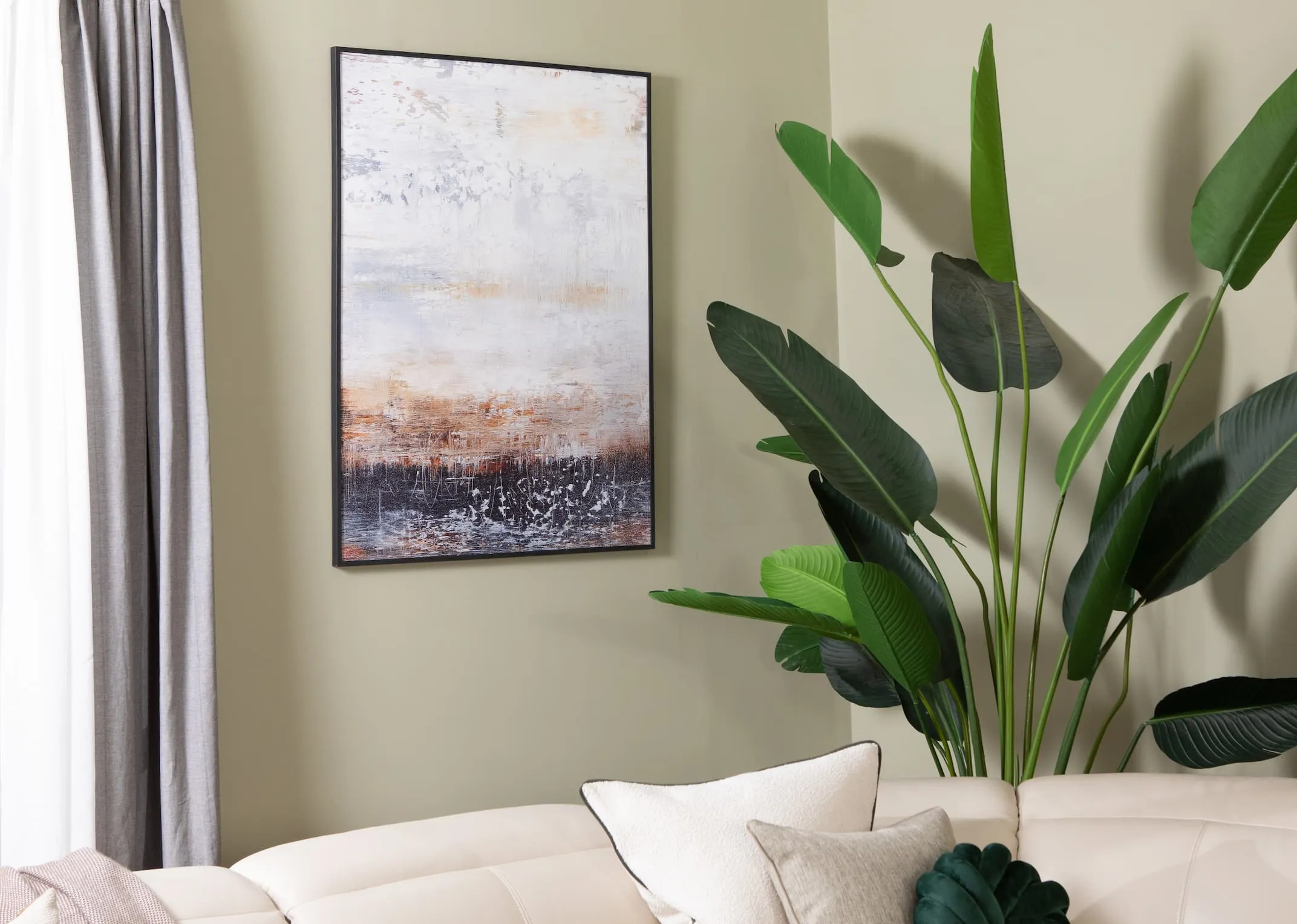 A lifestyyle image of the Fearless 1 canvas on a light green wall over a cream sofa.