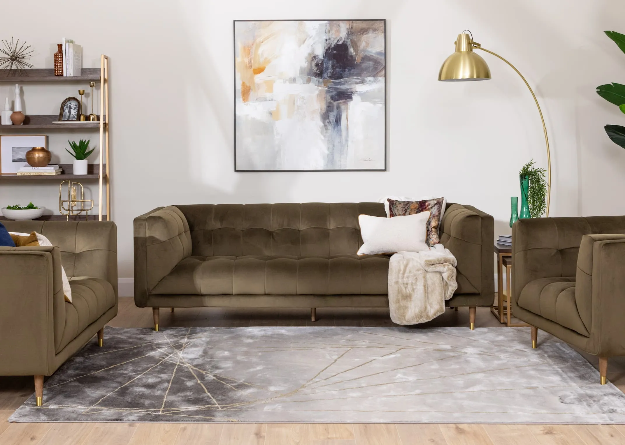 A lifestyle image of the Grace green velvet sofa with Greenwich bookcase and Fiona lamp with avery rug.