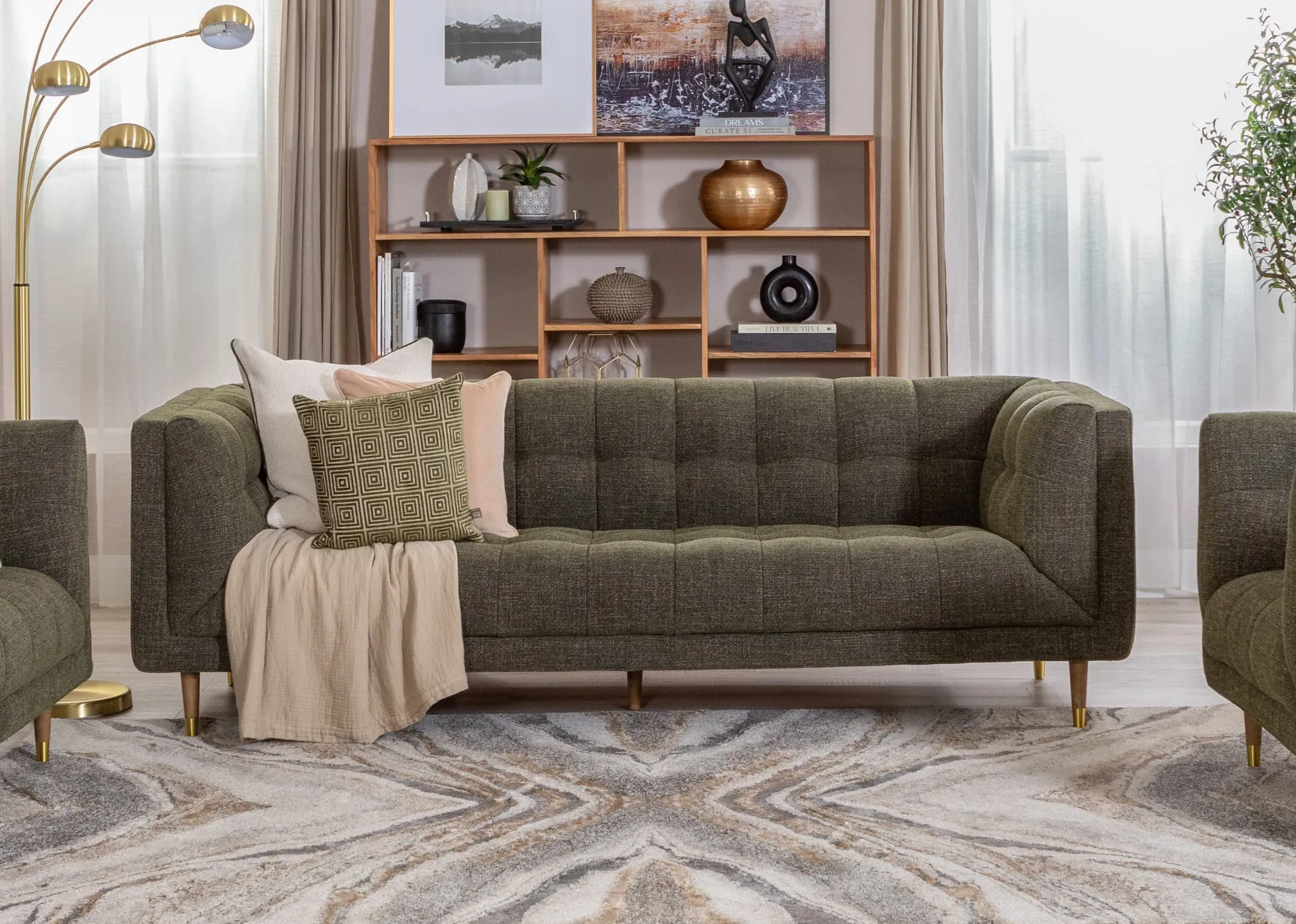 A lifestyle image of the Grace 3.5 Seater sofa with Mango display unit and Savonna lamp.