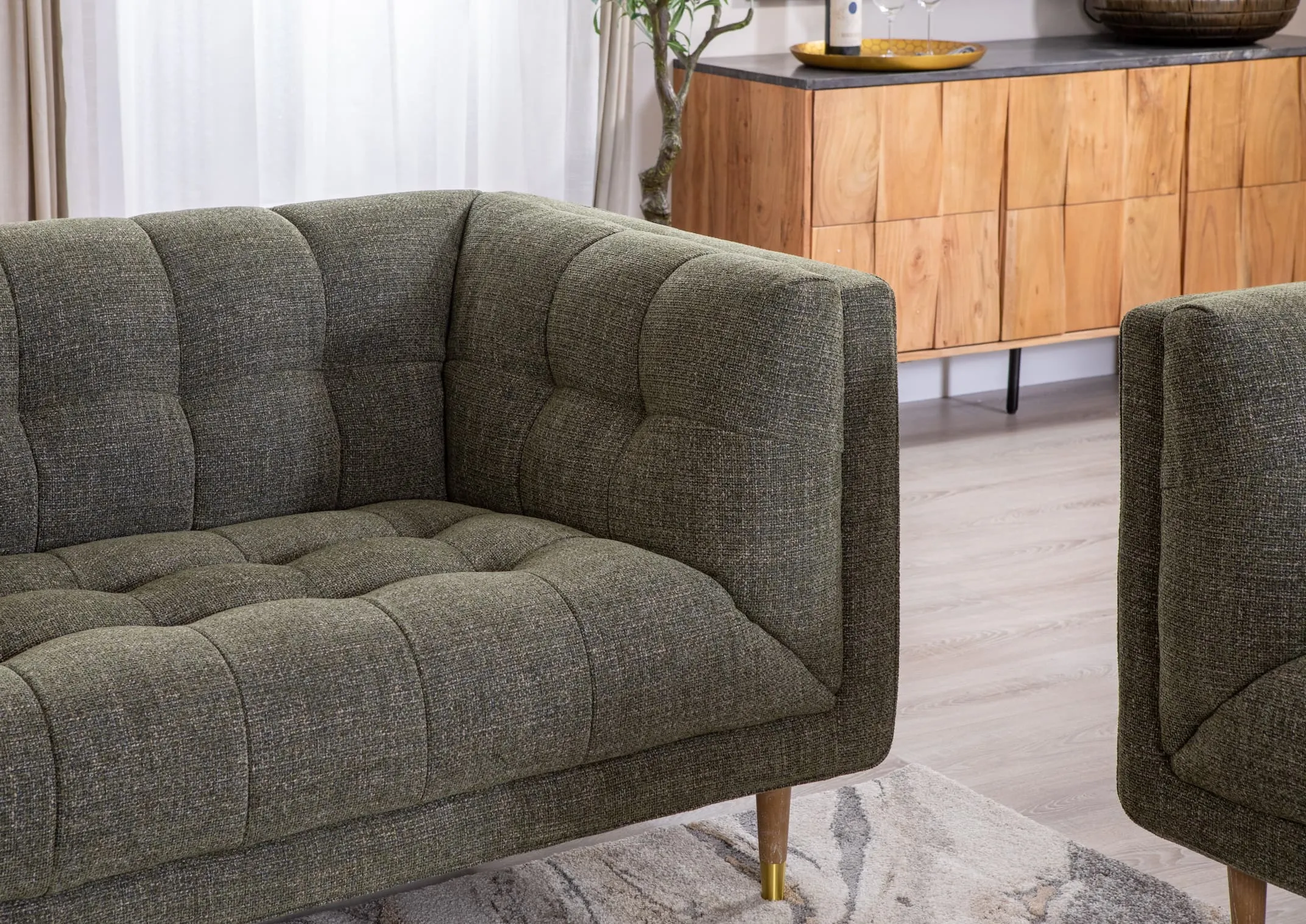 A lifestyle image of the Grace 3.5 Seater sofa with Mango sideboard.