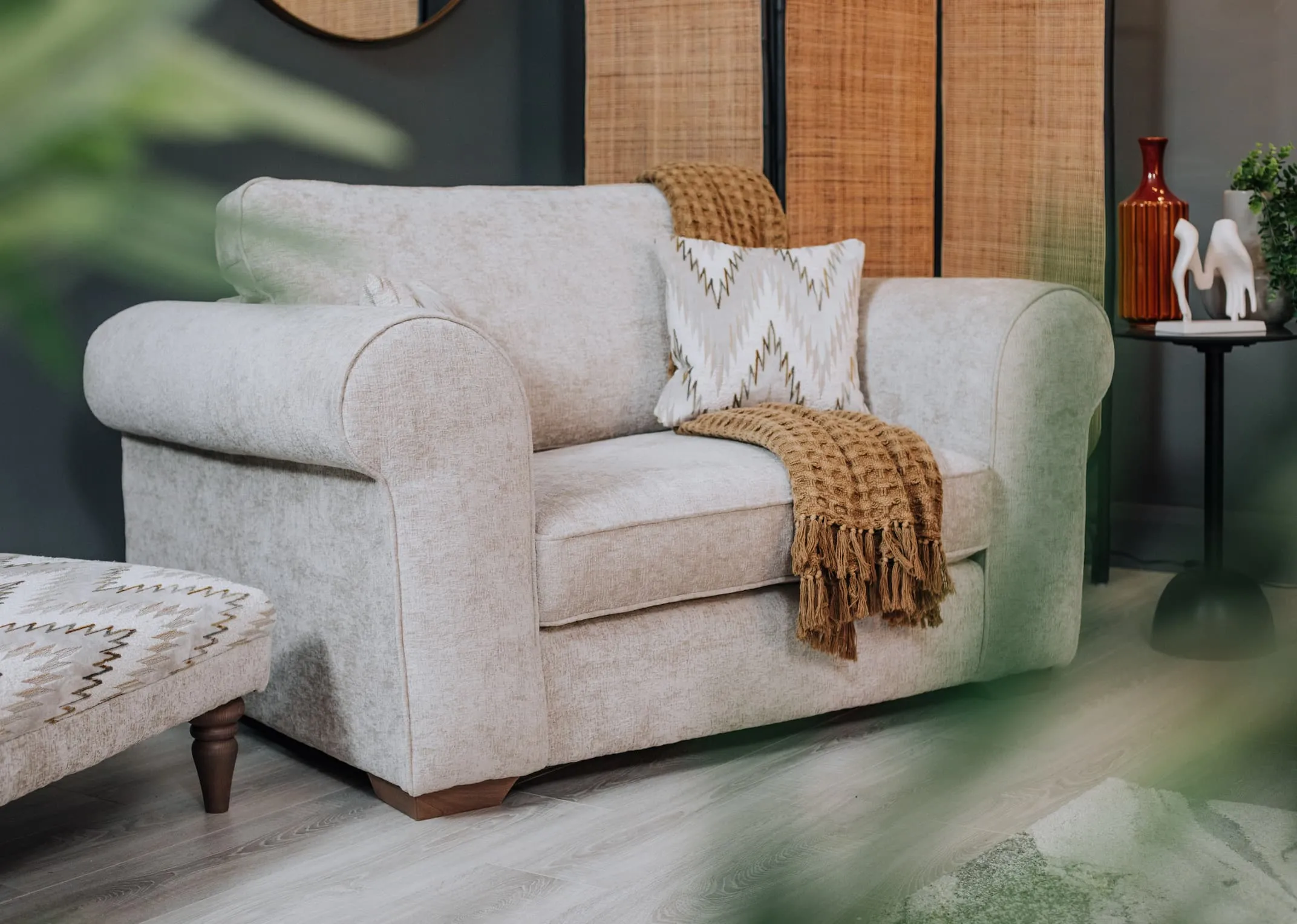 A lifestyle image of the Hayden Cuddler with waffle throw.