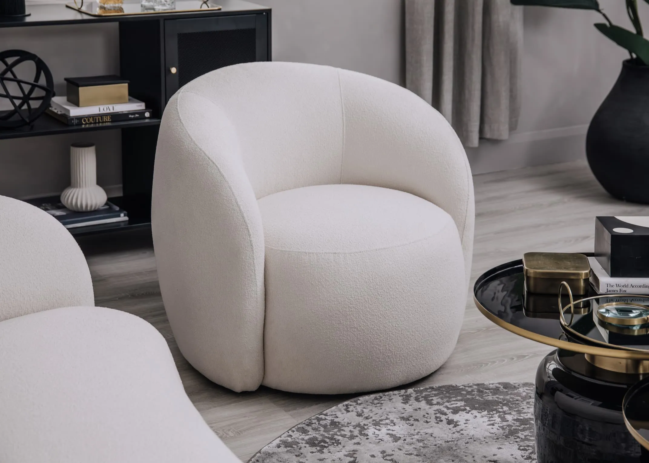 A lifetsyle image of the Florance off white accent chair with Carmel sideboard