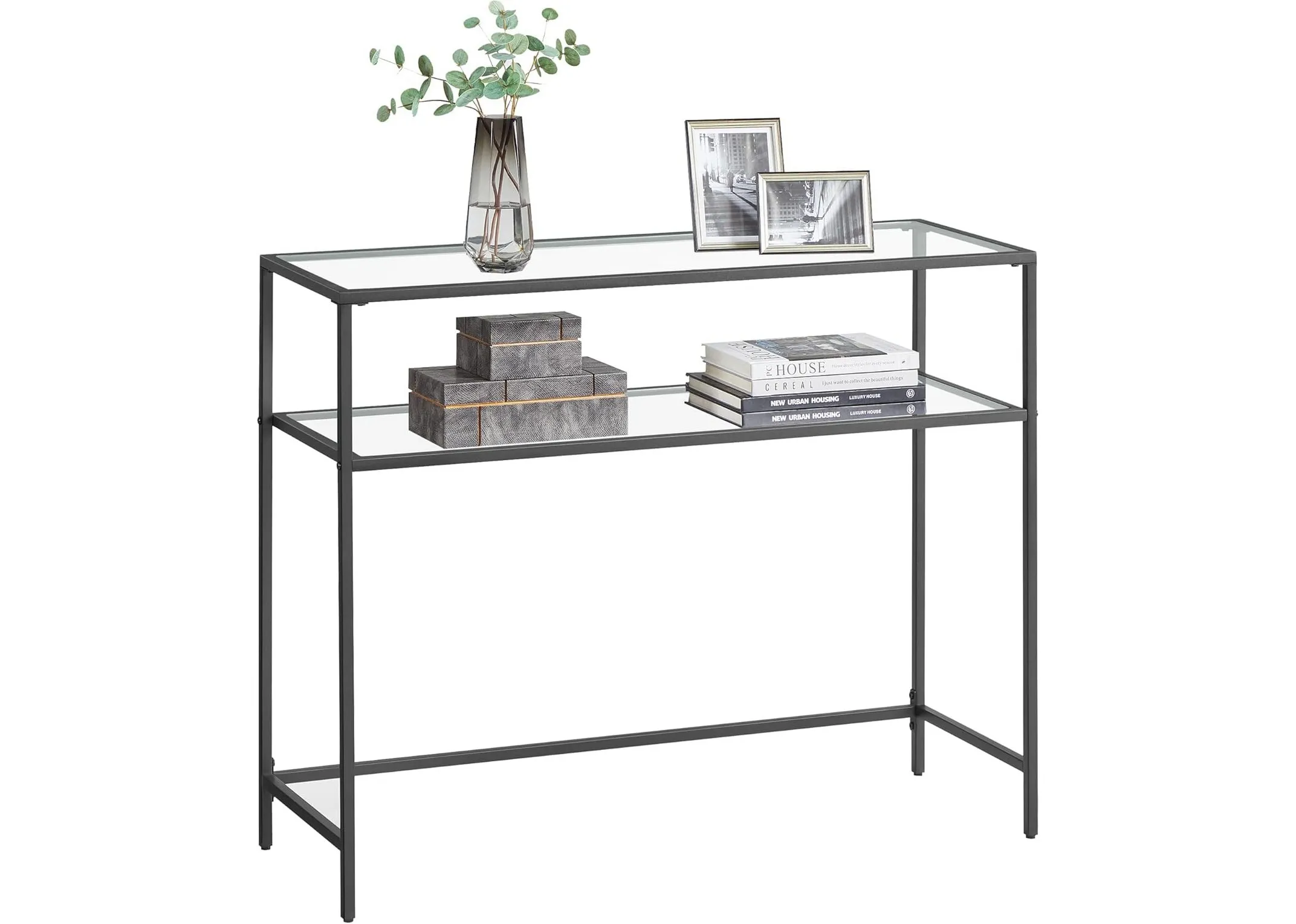 A black metal console table with glass shelves from EZ Livings Zafon range. Closeup of 5mm glass shelf