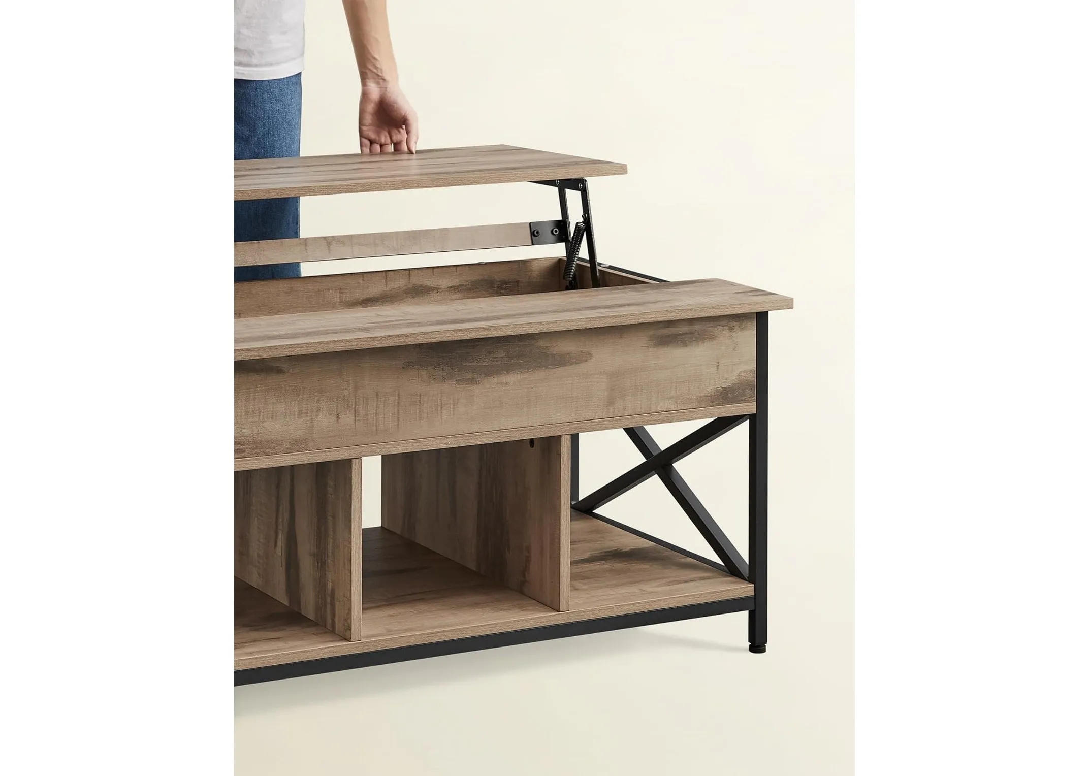 A lifestyle image showing the Ezra coffee table showing the open function.