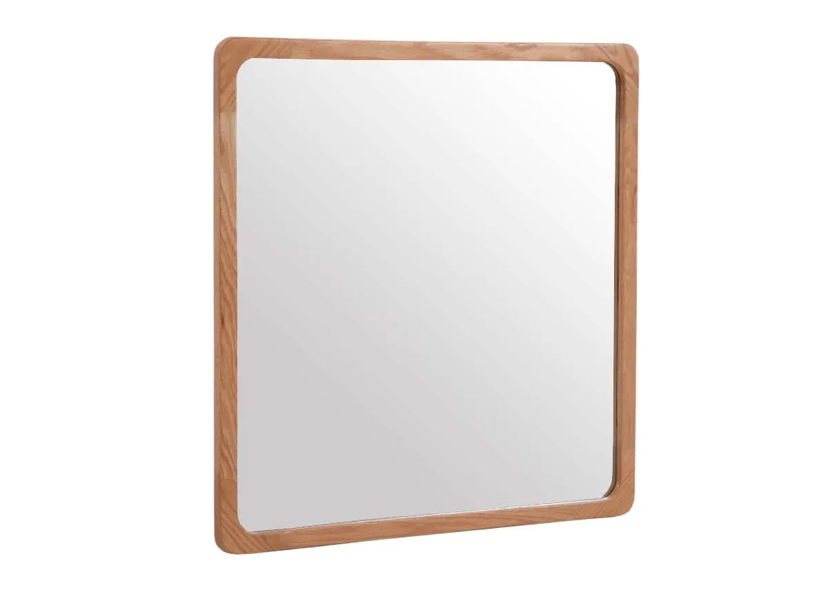A square wall mirror with oak frame from EZ Livings Charity range. Angled view