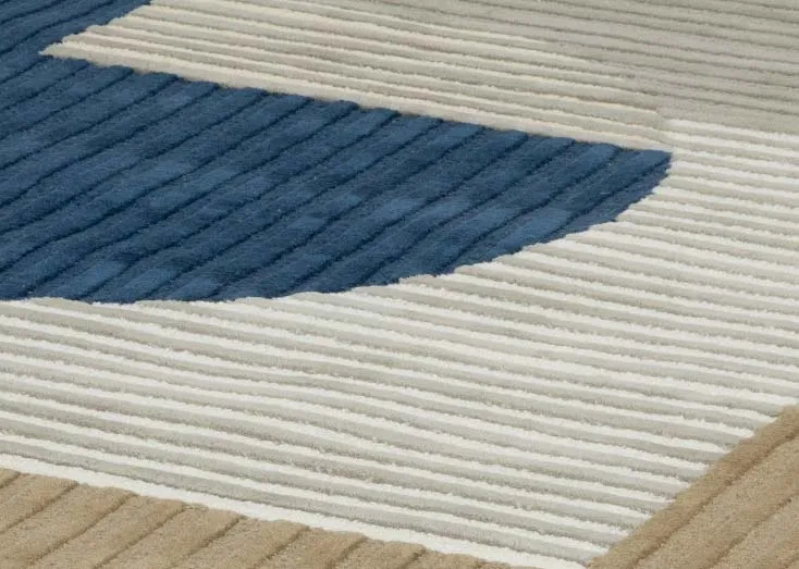 A green grey and navy abstract shaped rug from EZ Livings Geo range. Closeup of ribbed texture.