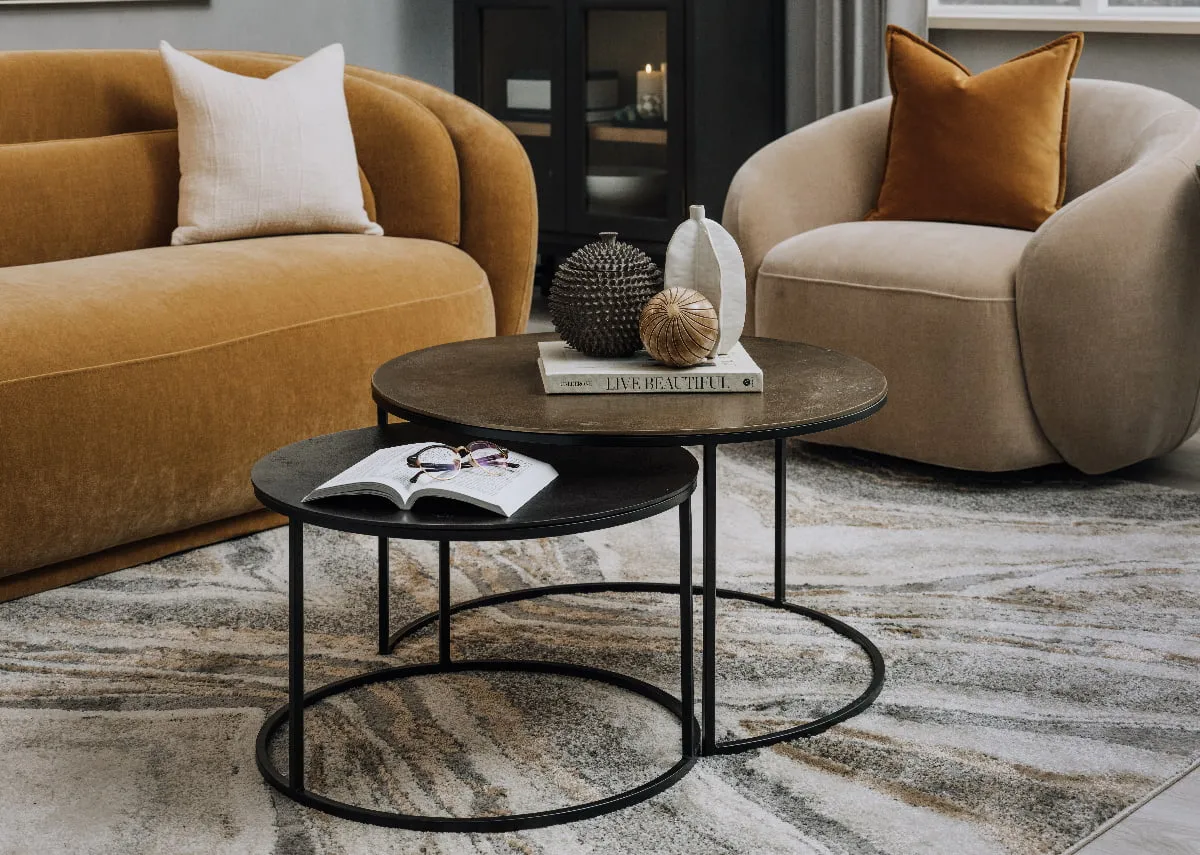 A lifestyle image of the Kersen nest of tables with the Canice sofa.