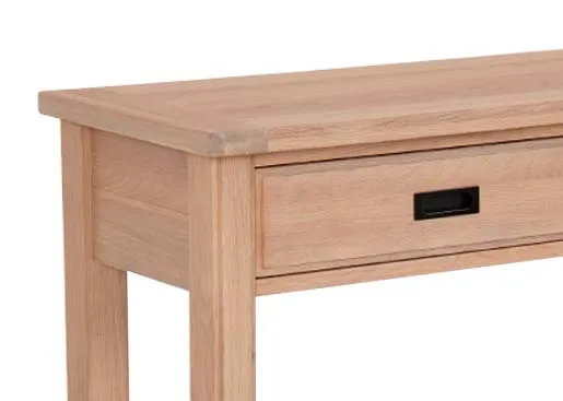 A 2 drawer oak console table with lower shelf from EZ Livings Albany range. Closeup of metal handle on frawers and oak finish on tabletop.
