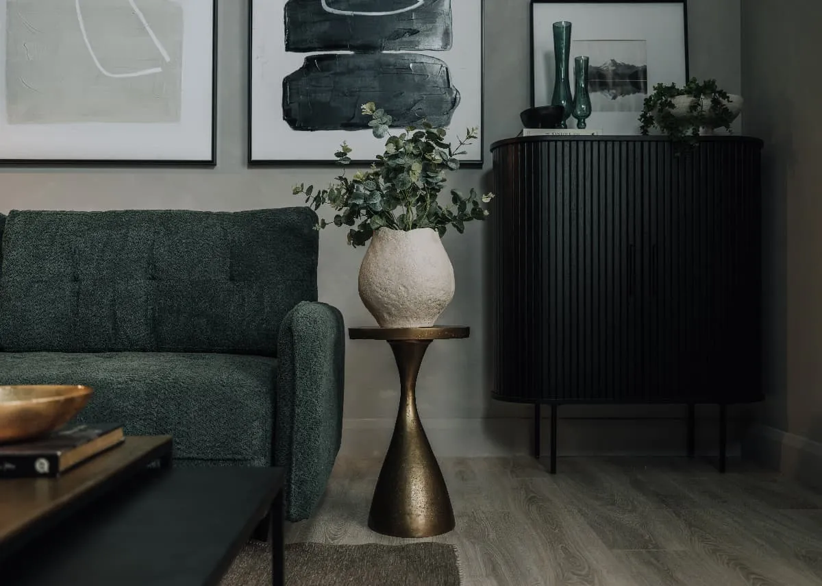 A lifetsyle image of the Bulan gold side table with Nola cabinet and Merrion sofabed