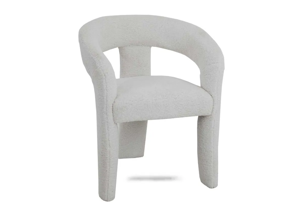 A white boucle dining chair from EZ Livings Hepburn range. Angled view of chunky chair.
