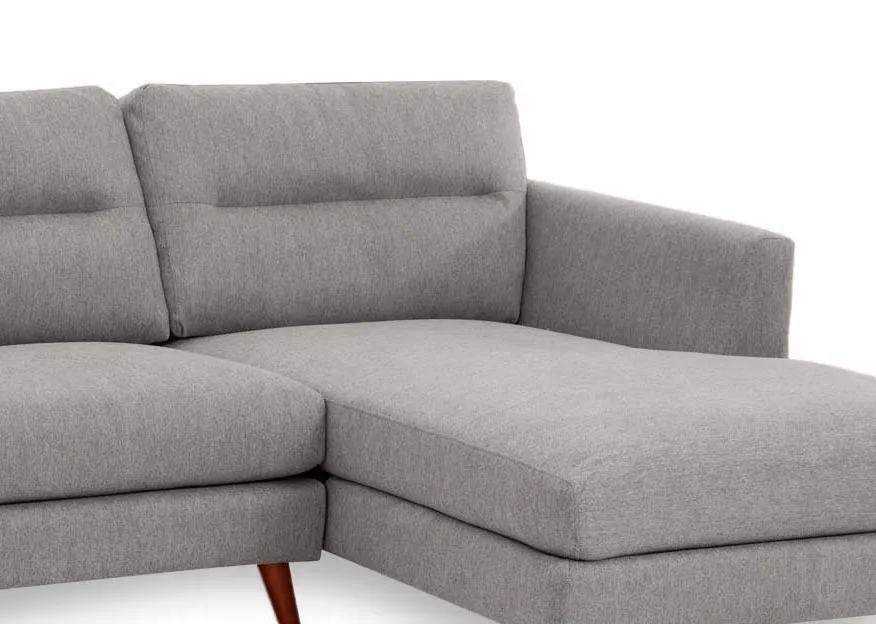 A light grey RHF corner chaise from EZ Livings Presley range. Closeup of grey fabric