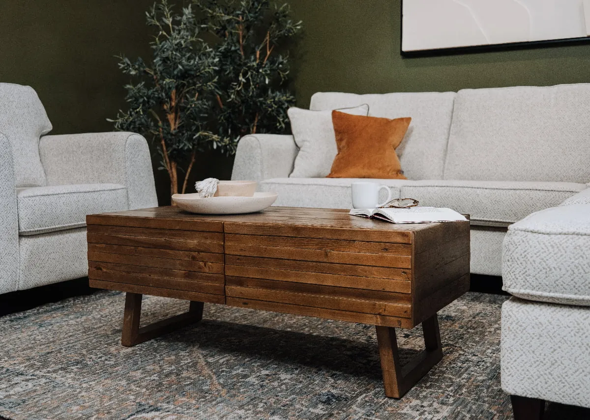 A lifestyle image of the Ladder coffee table with a dish and decorative bowl.