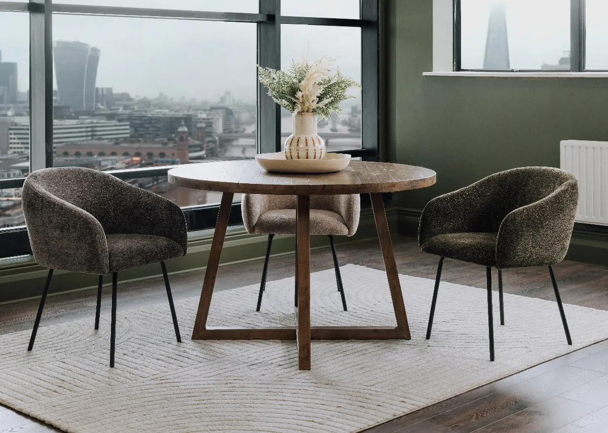 A ladder round dining table with Rotterdam chairs in green