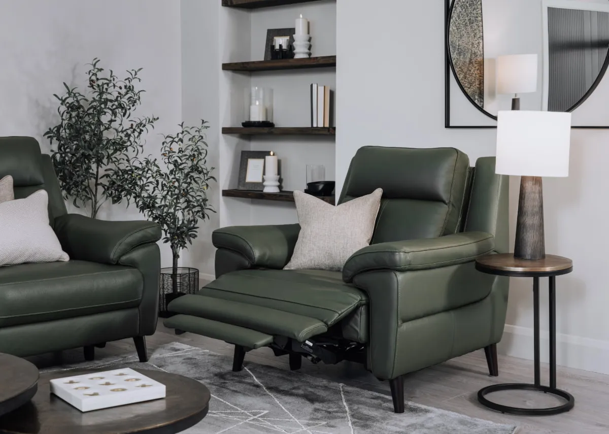 A lifetsyle image of the Elliot power recliner fully reclined with toko side table &