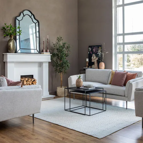 Helsinki sofa range from EZ Living Furniture with brown walls.