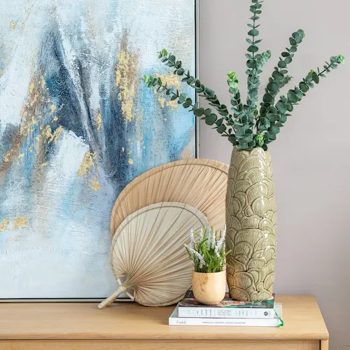 Eucalyptus sprays in Travis Olive green vase from EZ Living Furniture.