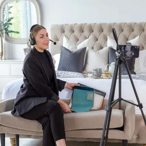 EZ Living Furniture sales advisor during live video call with customer.