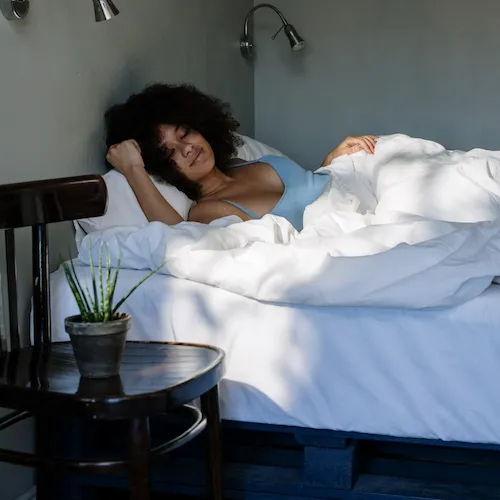 Woman sleeping with sunlight.
