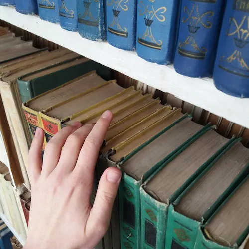 Hand touching books