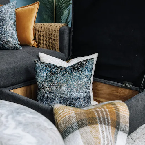 A selection of cushions in a footstool EZ Living Furniture.