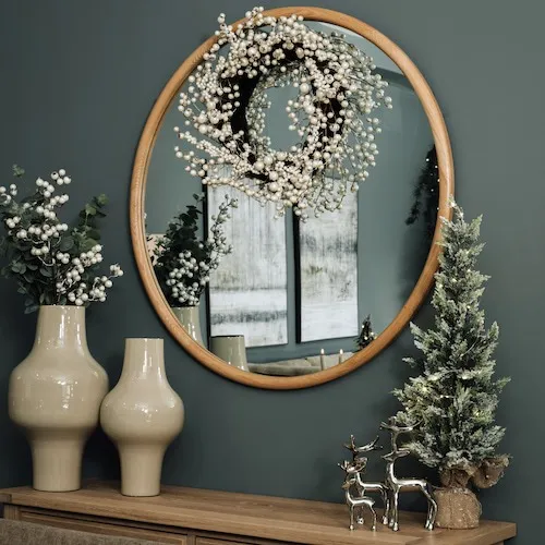 Pearl wreath from EZ Living Furniture hanging from mirror.