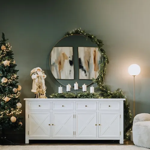 Pine Needle Garland with LED Lights from EZ Living Furniture wrapped around a mirror.