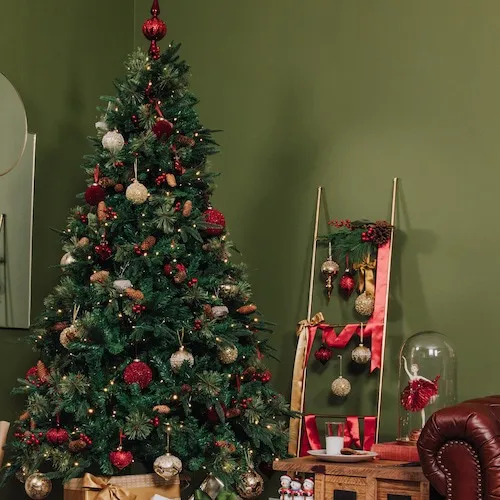 Red & Gold Christmas Baubles hanging from decorative ladder.