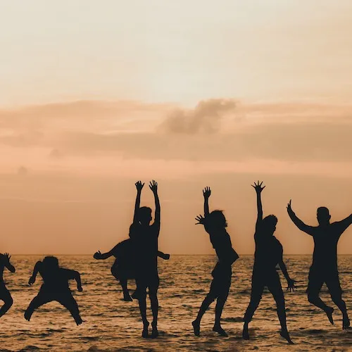 Family and friends jumping
