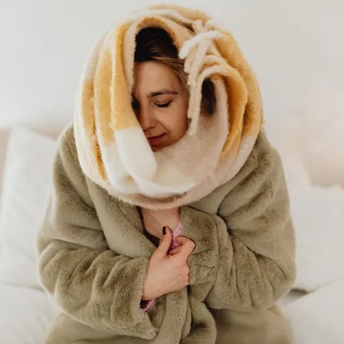 Woman wrapped in blankets