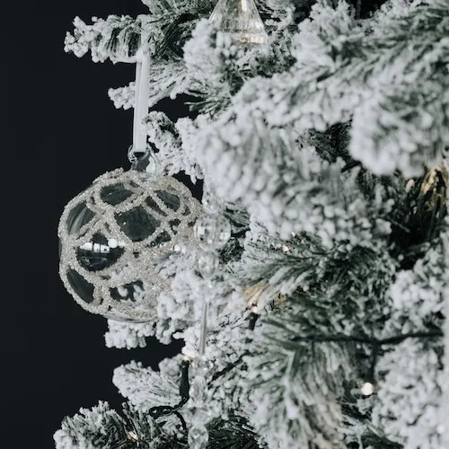 Snow-Covered Christmas Tree at EZ Living Furniture.