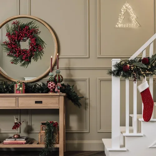 Berry wreath and garland at EZ Living Furniture.