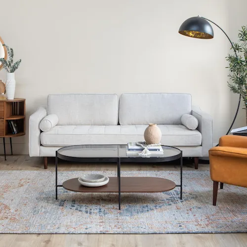 Black metal and walnut oval Glam coffee table from EZ Living Furniture.