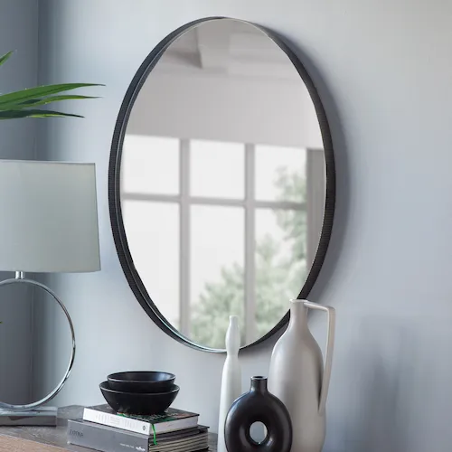 Paige Round bronze mirror from EZ Living Furniture.