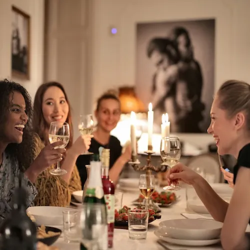 Group of people enjoying a dinner party.