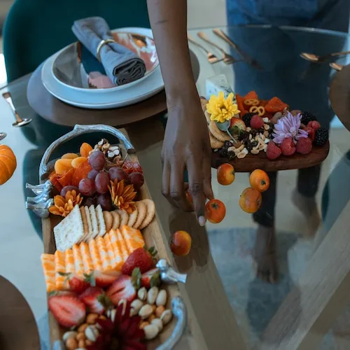 Cheese and crackers and other foods on table.