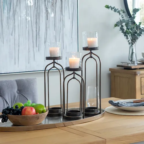 Knot bronze candle holders from EZ Living Furniture.