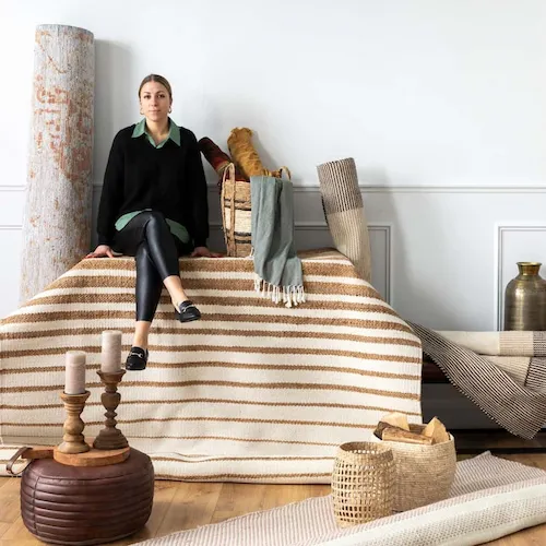 EZ Living Furniture's Ola sits on a selection of rugs and home accessories.
