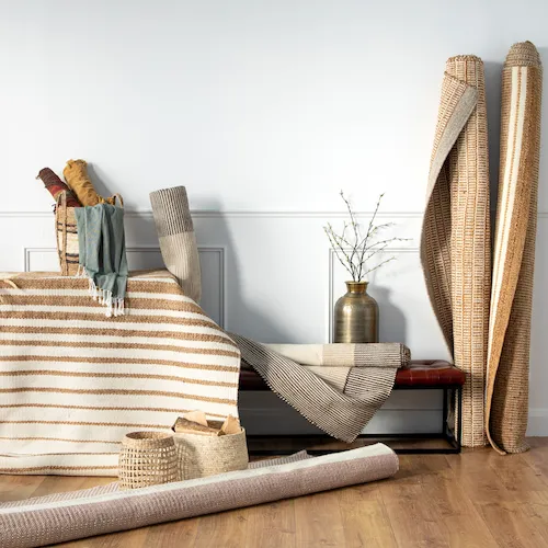 A selection of rugs vases and throws from EZ Living Furniture.