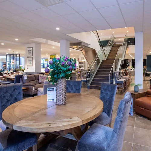 Interior of the EZ Living Furniture Tullamore Store with dining table and chairs.