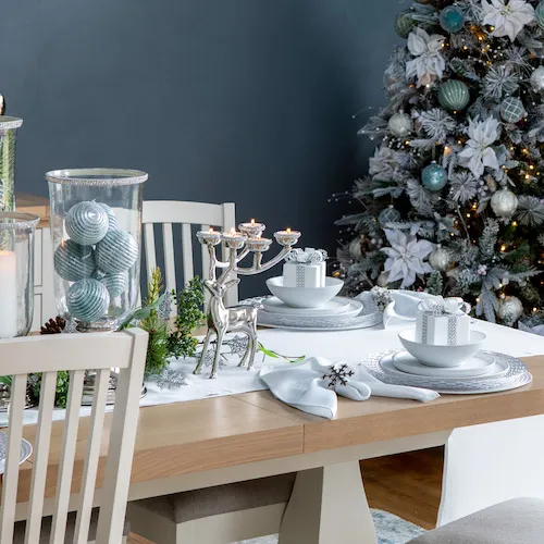 Blue and silver Christmas table setting.