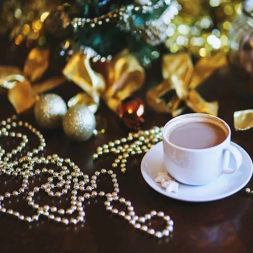 Beaded Christmas garlands with a cup of tea.