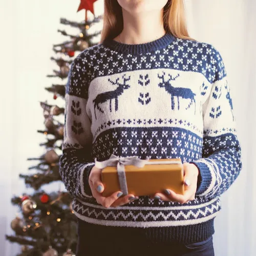 Woman in a Christmas jumper.